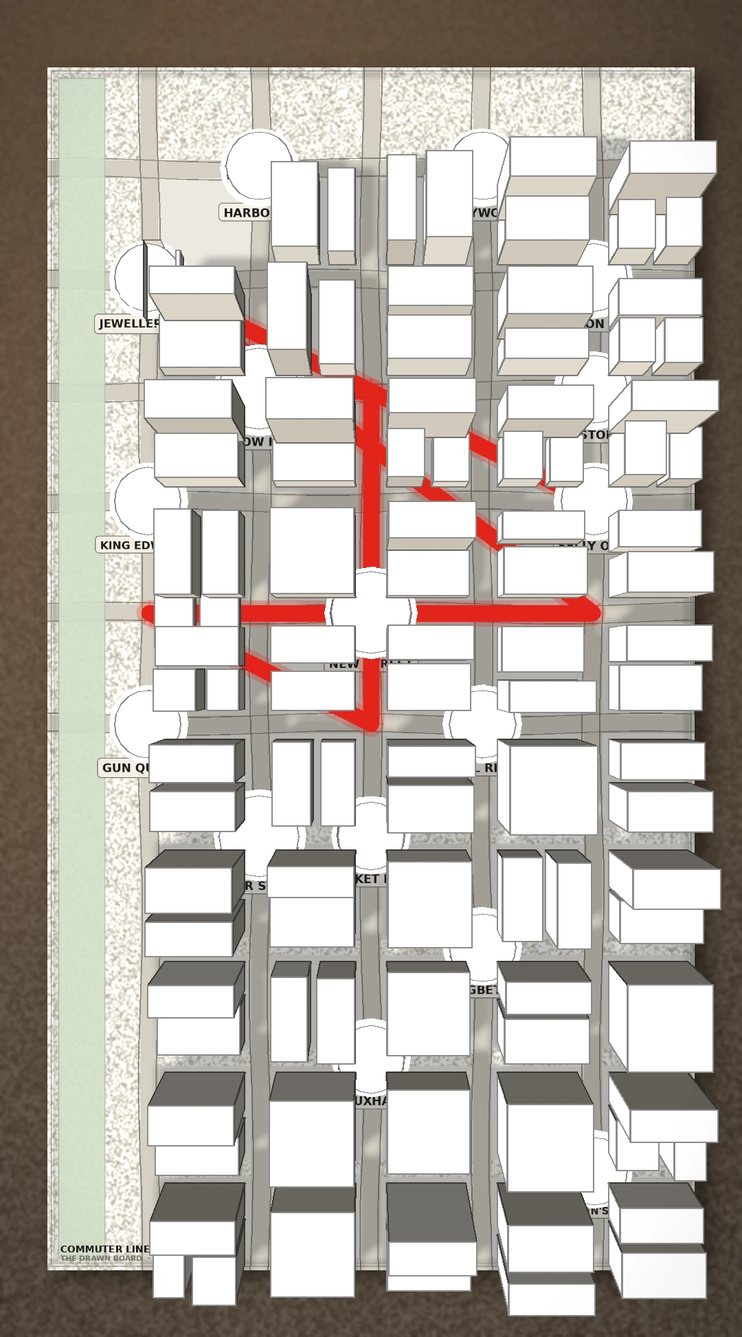 The same board seen from directly above, the atlas sheet filling the frame so the street plan, the place names and the red route read as a printed map.